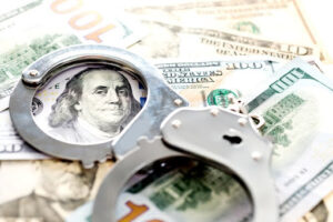Handcuffs lying on american dollars